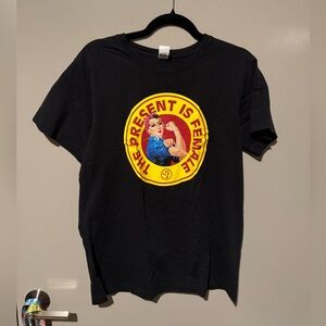 Zumba Fitness Black Tee with Bold Graphic “The Present is Female”